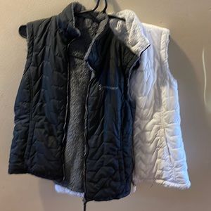 Two vest from free country, both reversible one white one black with pockets.